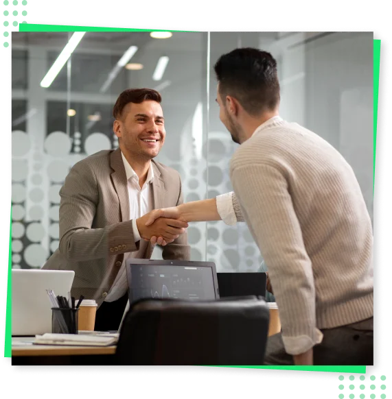 a man shaking hands with another man
