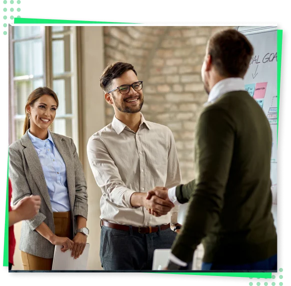 Two men shaking hands and a girl is smiling