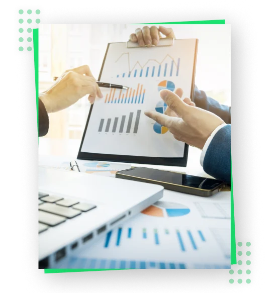 a close-up of a person pointing at a graph