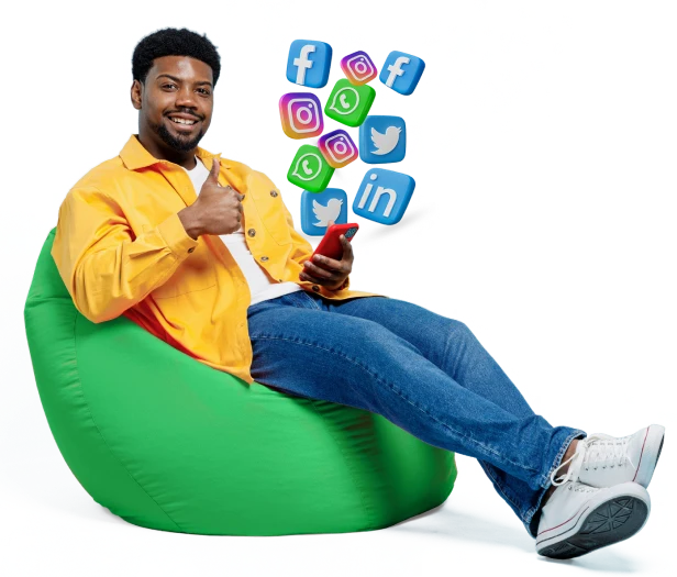 a man sitting on a bean bag with a thumbs up